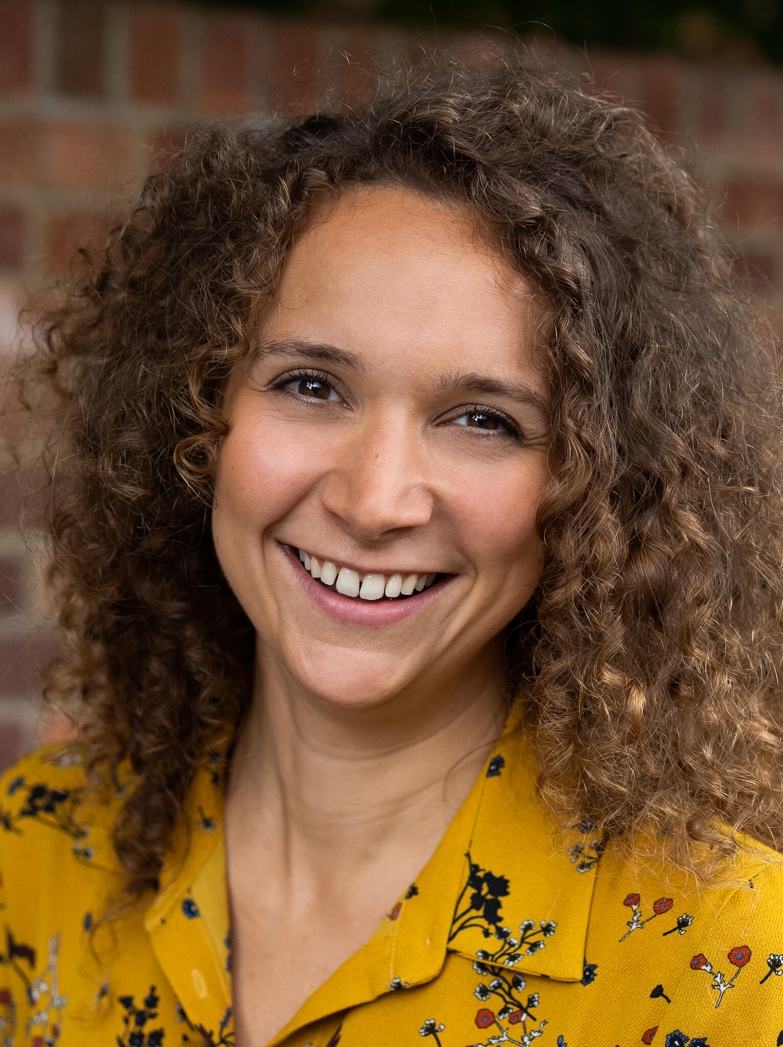 Engaging smileshowing that I am looking forward to working with clients, in a gentle compassionate way